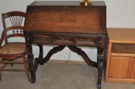 Antique caned chair, slant front desk with drawers, contemporary oak cabinet