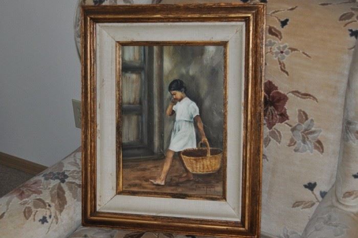 Framed portrait of a young girl, upholstered antique wing chair