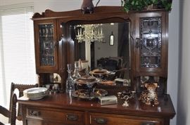 Art Nouveau c. 1905 breakfront leaded glass doors lined drawers beveled mirror, Meissen fish plates set of 6, silver plated serving pieces, Waterford Ashling crystal