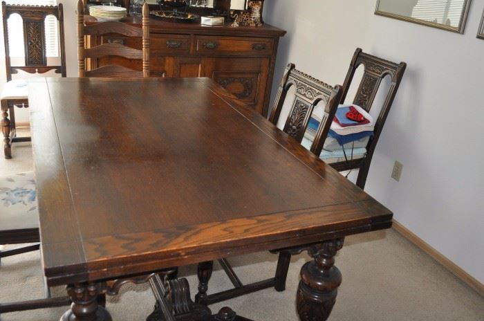 Antique oak draw leaf table, five antique oak side chairs