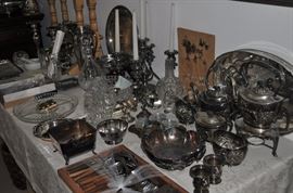 Lunt silver plate pair of ornate candlesticks, Lunt silver plate ornate oval platter, Monterey branded table, crystal decanters, large silver plate round tray, Apollo Loraline ice bucket w/tongs, Apollo Loraline cocktail shaker, Wilcox Meriden elaborate quadruple plate 4-arm 5-candle candelabra, crystal bowl, Mexican silver plate candleholders, Wallace silver plate wine bottle holder, Lunt silver plate bowl, square silver plate dish, Wilcox Meriden ornate silver plate bowl with cherry relief, large oval Sheffield silver plate tray with galley, IFS Israel Freeman & Son 6-piece tea and coffee service, Dansk Fjord teak stainless flatware 36 pieces