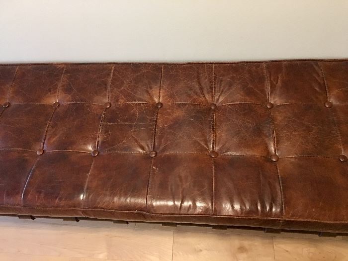 Detail of tufted leather bench