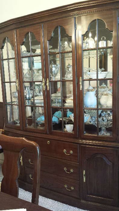 Cherry china cabinet is not for sale. Contents will be for sale: silver plate, pattern and milk glass, Limoges