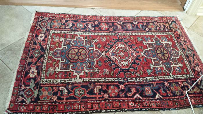 Small hall or entrance rug that coordinates with two larger rugs.