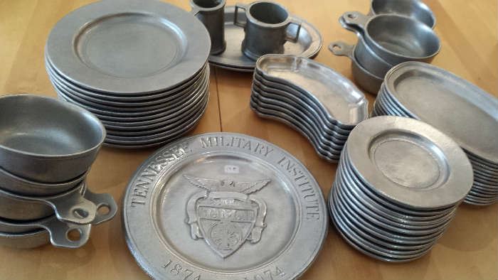 Pewter plates, mugs, porringers, accessories. There are 10 pewter mugs new in boxes.