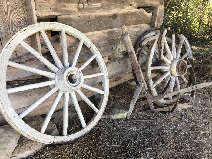 Heavy old wagon wheel and parts of wheels 