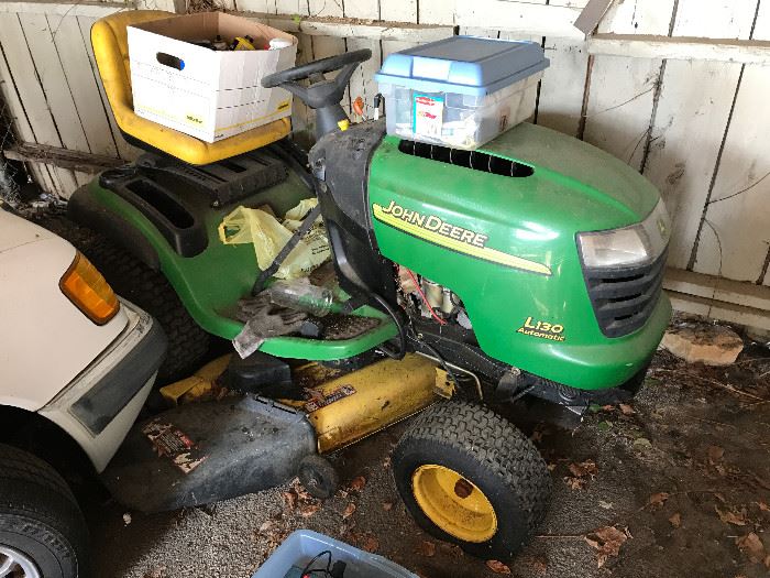 John Deere riding lawn mower, as is....taking Best Offer. Hasn't been started in a while and has a flat tire.