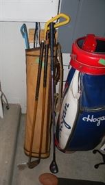 old wood clubs and golf bags