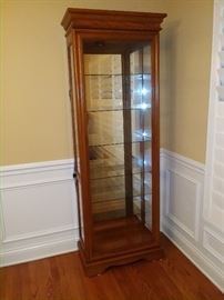 Great way to show off beautiful items, lighted cabinet with sliding door