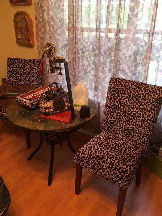 Leopard print chairs with bistro style table
