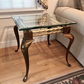 Polished brass side table with beveled glass top, cabriole legs, and rope twist stretchers. 