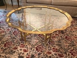 Scalloped edge, brass and glass cocktail table
