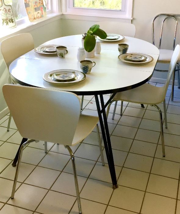Mid-century kitchen table and four contemporary chairs.