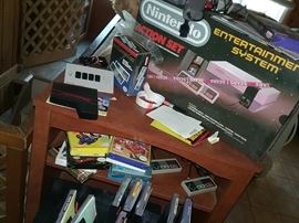Nintendo NES in box complete with manuals and many games in box with manuals. All in excellent condition 