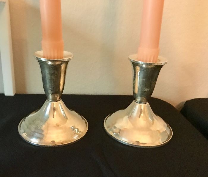Sterling weighted candle holders.