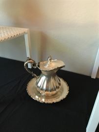 Silver plated creamer and plate.