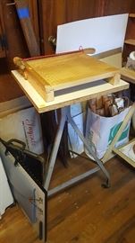 Paper cutter,  adjustable table