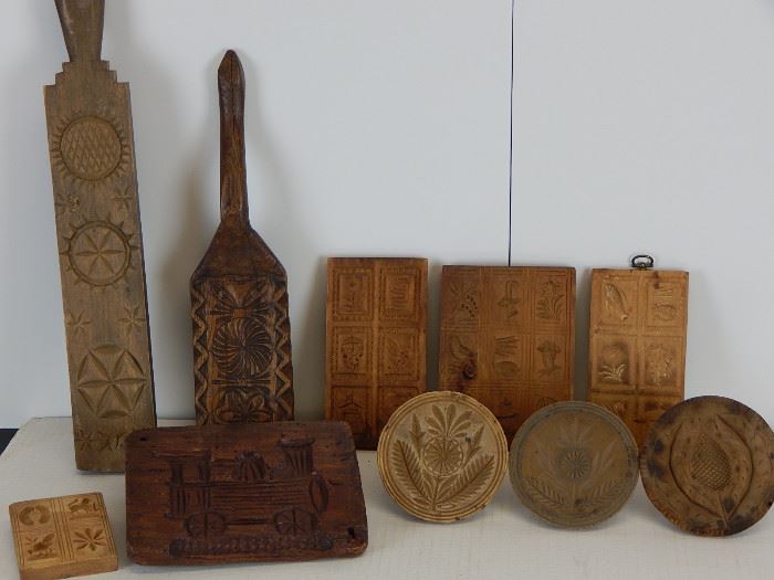 Variety of cookie and butter prints, early primitive carved Pa bed smoothers