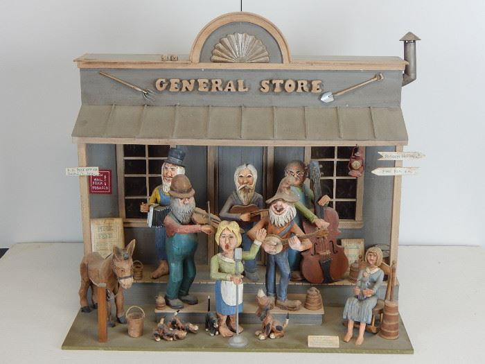 A great carved diorama by William Melchior depicting a country band on the steps of "The General Store"