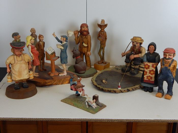An array of caricature carvings including a cowboy by "Caricature Carvers of America" President, Pete Leclair.The Caricature Carvers is an organization recognizing the best in the carving business.