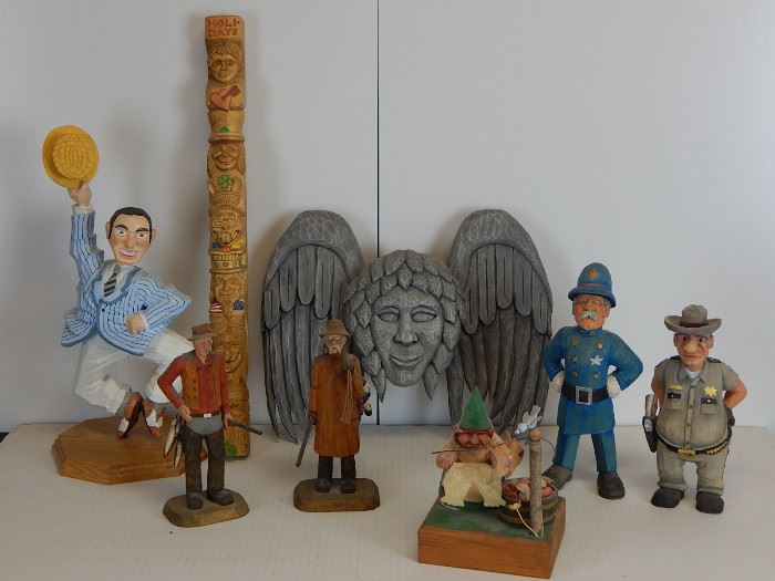 A set of two duck hunters from Cape Cod , a dancing Gene Kelly from Elmer Jumpers, two police officers,one by Dennis Thornton one of the best known carvers in America