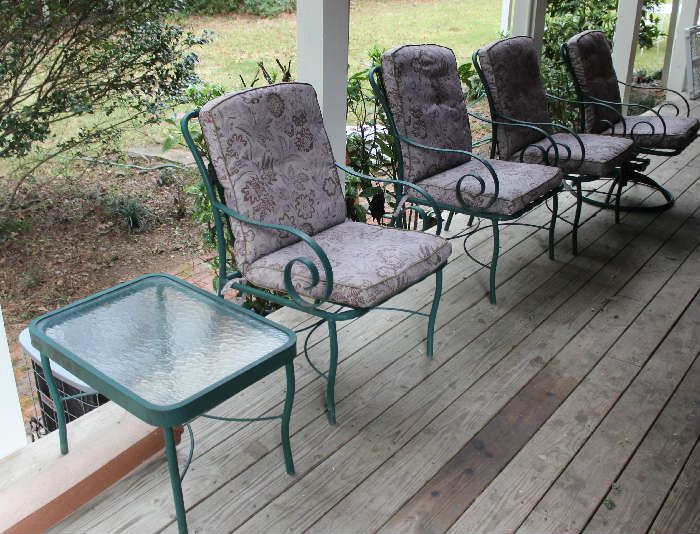The patio chairs with the glass end table.