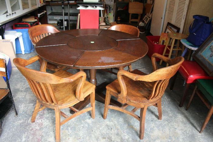 The round mahogany table with 4 solid oak chairs.