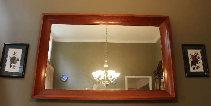 The large mirror with the handmade frame.