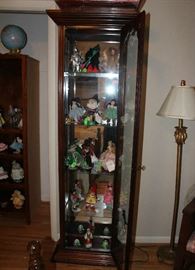 Close-up of the curio cabinet with the collection of Wizard of Oz characters.