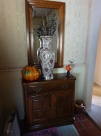 mirror and small cabinet
