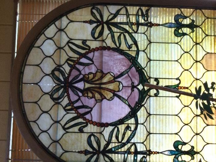 Amazing arched antique stained glass window
