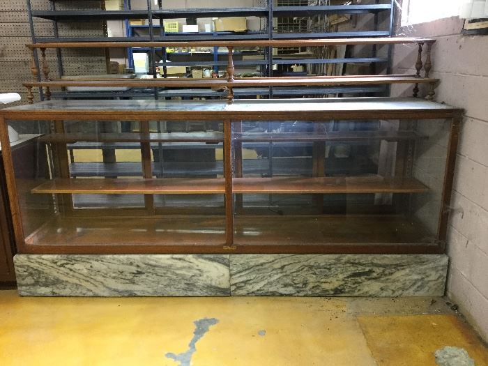 Beautiful antique display cabinet on marble base. Local providence. Bevel glass top with original oak two tier gallery.  