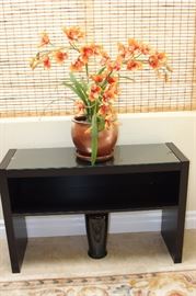 One otwo glass topped shelf. Silk orchid.