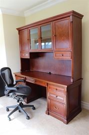 Cherry office furniture and Herman Miller ergonomic chair.