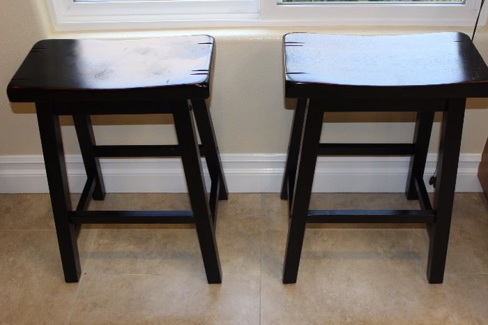 Two saddle stools.