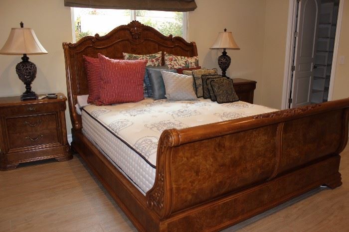 King size sleigh bed. Matching nightstands and table lamps.