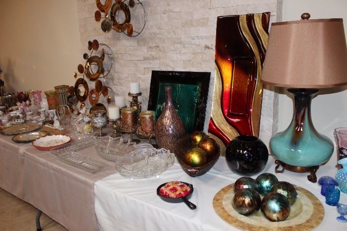 Hot glass pieces. Candles, table lamp and decorative balls.
