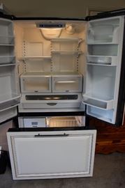 Fridge freezer with pull out freezer drawer.