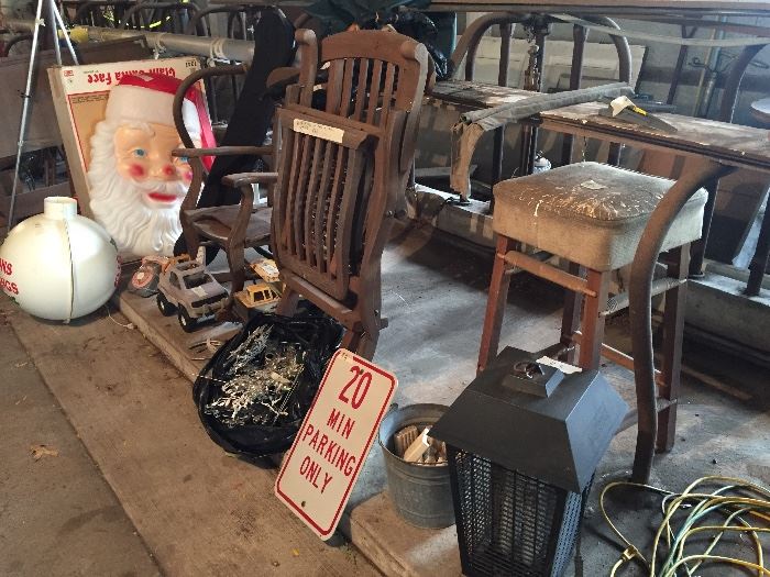 Santa Claus plastic outdoor decor, wooden chairs, street signs, bug zapper, hoses