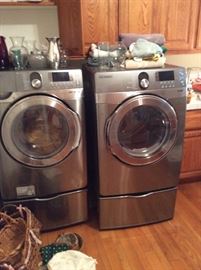 Samsung front load washer and dryer on pedestals
