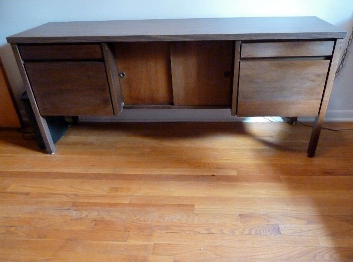 Mid Century Modern credenza by National Office Furniture. two shallow drawers, 2 file drawers, center storage section with sliding doors.   Wood and laminate.
