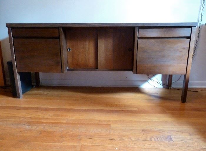 Mid Century Modern credenza by National Office Furniture. two shallow drawers, 2 file drawers, center storage section with sliding doors.   Wood and laminate.