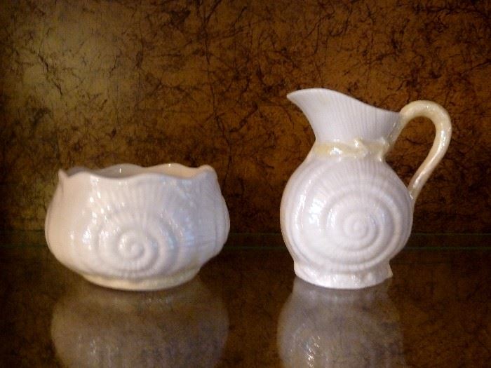 Belleek creamer and sugar bowl, cream shell pattern with  Limpet Yellow iridescent accents.