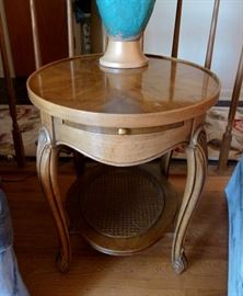 Pair of solid wood end tables with pull-out tray and caned bottom shelf.  20" x 25"