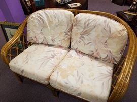 Nice rattan loveseat...good condition...recover cushions to update if you like!