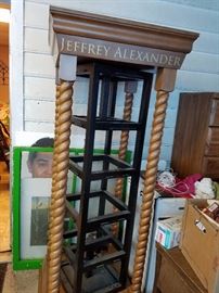 Lovely revolving display with wood spindle design.