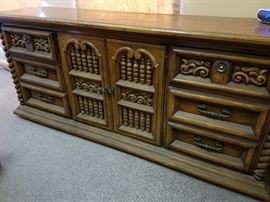 The amazing vintage, solid-wood dresser would be amazing painted or glazed.  It could be a beauty if given a little TLC!