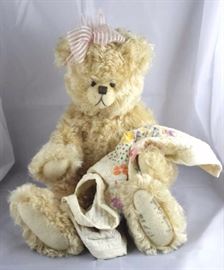 Lovingly-265. Paula Egbert-Teddy Bear Heaven. In  mohair (distressed)-creamy gold standing at 18" H  in excellent condition. 1992 Disney Land  Convention-Teddy Bear Classic. Signed. Wears a  pale pink head band with bow. 
