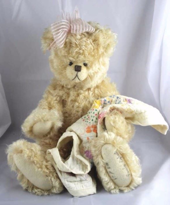 Lovingly-265. Paula Egbert-Teddy Bear Heaven. In  mohair (distressed)-creamy gold standing at 18" H  in excellent condition. 1992 Disney Land  Convention-Teddy Bear Classic. Signed. Wears a  pale pink head band with bow. 
