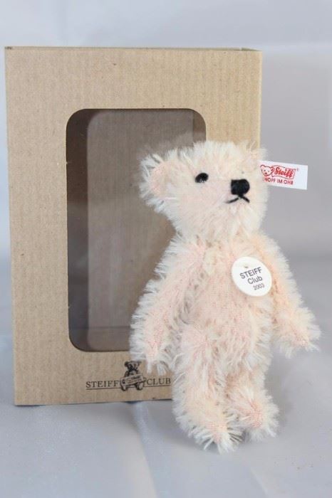 Rose Teddy Bear - 1006. Steiff U. S. Club 2003  Gift with string plush-rose mohair. 3.5" H in  excellent condition with box. Has white ear tag  (red printed) with the button and tag specially  sized. Wears a round chest tag "Steiff Club 2003".
